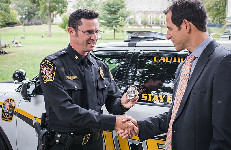 Police officer getting their badge