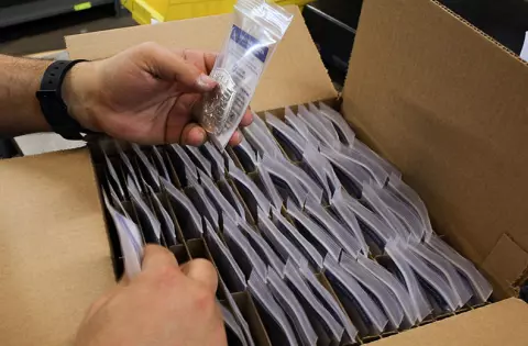 Shipping badges to dealer