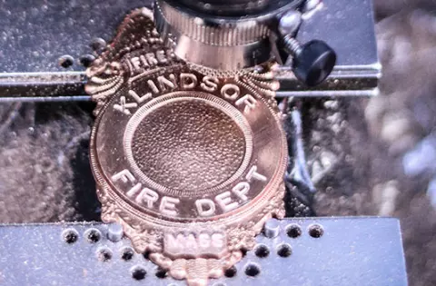 Engraved Lettering on a police or fire custom badge